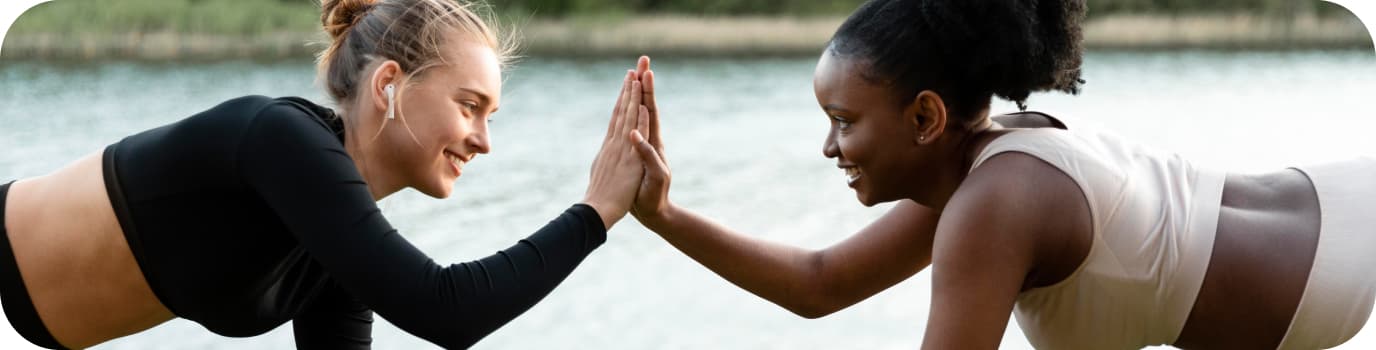two woman do exercises